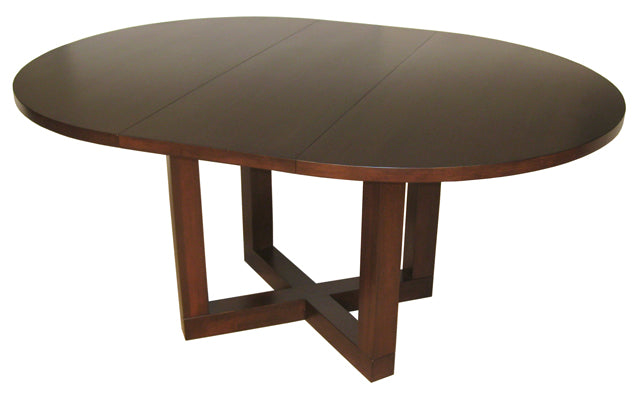 The Tangent Pedestal Table with leaf is one of our exclusive in-house designs. Built to order in BC, it is shown here with a 48” round top and 16” leaf in Maple wood and Java stain.