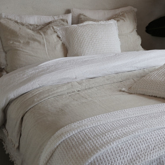 Eve Duvet Cover layered with different textured beddings